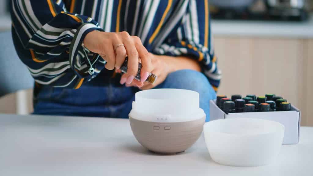 Adding essential oils into diffuser