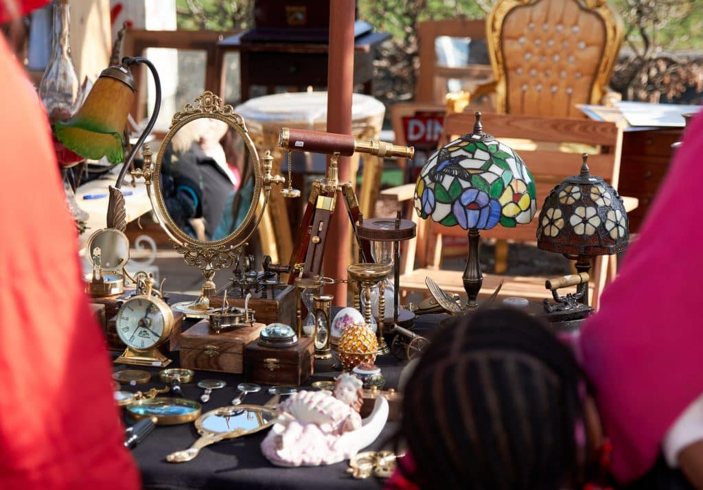 Vintage items for sale at a stall on street flea market.