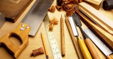 woodworking tools placed on wooden surface