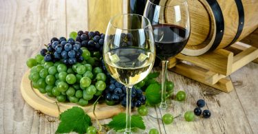 red and white wine with grapes