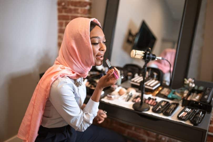 A picture of women doing makeup