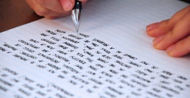 A person writing on paper