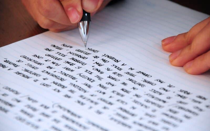 A person writing on paper