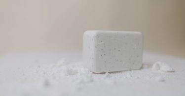 a close up shot of a white bar soap