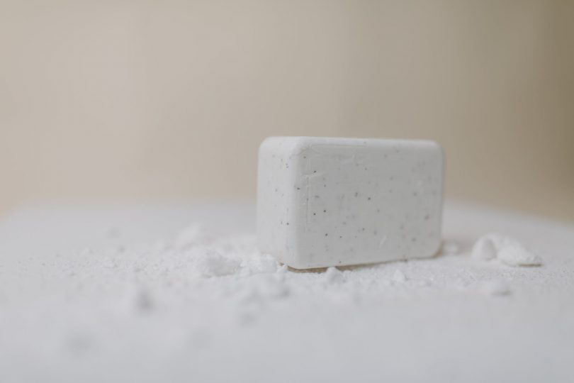 a close up shot of a white bar soap