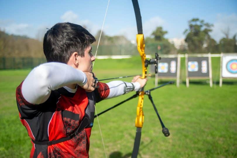 archer aiming on an archery target
