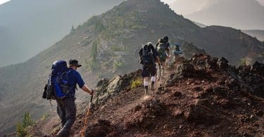 group of person walking in mountain