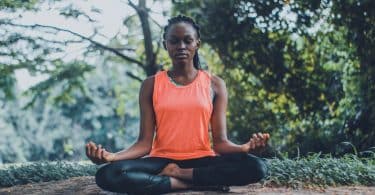 woman meditating in the outdoors