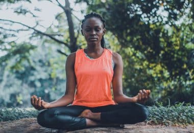 woman meditating in the outdoors