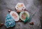 set of creative handmade soaps placed on table with dried plants