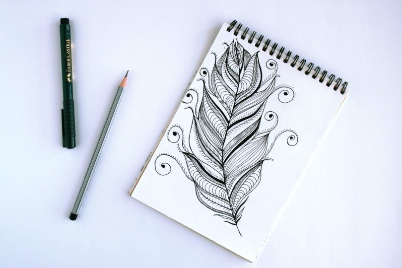 spring book with feather sketch